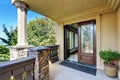 Luxury house exterior. Entrance column porch with railings.