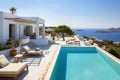 Luxury house or hotel with pool in Greek style by sea in summer Royalty Free Stock Photo