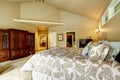 Luxury house interior. Bedroom with high vaulted ceiling a