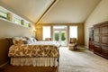 Luxury house interior. Bedroom with high vaulted ceiling and walkout deck Royalty Free Stock Photo