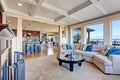 Luxury house with open floor plan. Coffered ceiling, carpet and Royalty Free Stock Photo