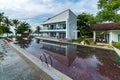 Luxury house reflected on the swimming pool calm and clear water