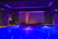 Luxury Indoor Swimming Pool with Vibrant Blue Lighting in Zermatt Hotel Royalty Free Stock Photo