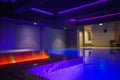 Luxury Indoor Swimming Pool Area with Ambiance Lighting, Textured Stone Walls, Zermatt, Switzerland Royalty Free Stock Photo