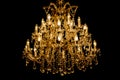 Luxury interior chandelier has light candles and dark background