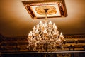 Luxury interior chandelier has light candles.