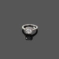 Luxury jewellery. White gold or silver ring isolated on gray background. Selective focus. Royalty Free Stock Photo