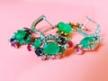 Jewelry green emerald silver pink opal costume jewelry for women on living coral background