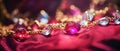 Luxury jewelry with jemstones on red fabric, horizontal blurred background with bokeh effect and copy space