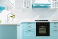 Luxury kitchen interior in white and blue tones Royalty Free Stock Photo