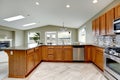 Luxury kitchen room with bright brown cabinets Royalty Free Stock Photo