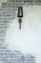 Luxury lamp hanging on brick and plaster wall