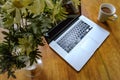 Luxury laptop computer seen on a kitchen table during a coffee break.