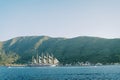 Luxury large sailboat sails on the sea along the mountainous coast