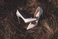 White leather shoes on the grass. Royalty Free Stock Photo