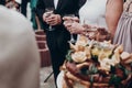 luxury life concept. champagne and wine glasses in hands at luxury wedding reception at restaurant. guests toasting and cheering Royalty Free Stock Photo