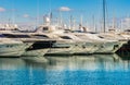 Luxury lifestyle, big motor yachts and sailing boats moored at marina