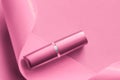 Luxury lipstick and silk ribbon on pink holiday background, make-up and cosmetics flatlay for beauty brand product design