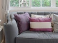 Luxury living room design with classic sofa and decorative purple pillow Royalty Free Stock Photo