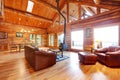 Luxury log cabin living room with leather sofa. Royalty Free Stock Photo