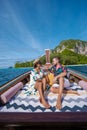 Luxury Longtail boat in Krabi Thailand, couple man and woman on a trip at the tropical island 4 Island trip in Krabi