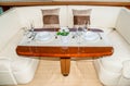 Luxury lunch table setting on a yacht interior Royalty Free Stock Photo