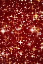 Luxury, magic and happy holidays background, golden sparkling glitter, gold stars and magical glow on festive red Royalty Free Stock Photo