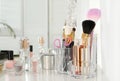 Luxury makeup products and accessories on dressing table with mirror. Royalty Free Stock Photo