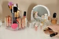 Luxury makeup products and accessories on dressing table with mirror Royalty Free Stock Photo