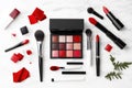 Luxury makeup set on marble table: brushes, lipsticks, and eyeshadows for a chic look Royalty Free Stock Photo