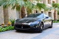 The luxury Maserati Granturismo car is near luxurious hotel