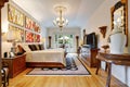 Luxury master bedroom interior with carved wooden furniture. Royalty Free Stock Photo