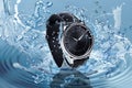 Luxury men`s watch in water splashes demonstrating its waterproof Royalty Free Stock Photo