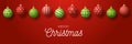Luxury Merry Christmas horizontal banner. Christmas card with ornate red and green realistic balls hang on a thread on red