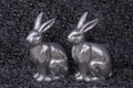 Luxury metal easter bunnies in silver on dark background