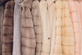 Luxury mink coats. Grey, brown, pearl color fur coats on showcase of market. Best gift for women is mink coat. Outerwear