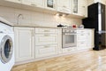 Luxury modern beige and white kitchen interior Royalty Free Stock Photo