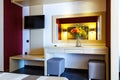 Luxury modern hotel room interior details. mirror and vase of flowers on table Royalty Free Stock Photo