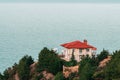 Luxury modern house with red roof on sea shore. Vacation home for family. New residential building. Sale or rental of apartments Royalty Free Stock Photo