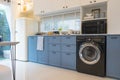 Modern kitchen interior with washing machine. Royalty Free Stock Photo
