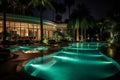 Luxury Modern Resort Hotel with Swimming Pool and Tropical Nature Background at Night Royalty Free Stock Photo