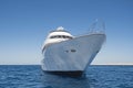 Luxury motor yacht sailing out on tropcial sea Royalty Free Stock Photo