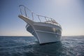Luxury motor yacht sailing out on tropcial sea Royalty Free Stock Photo