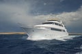 Luxury motor yacht sailing out on tropcial sea Royalty Free Stock Photo