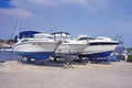 Luxury motor yachts at shipyard waiting for maintenance Royalty Free Stock Photo