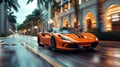 luxury orange sports car drives fast on road in the city at resort with palm trees. Motion blur Royalty Free Stock Photo