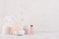 Luxury organic body and skin care spa cosmetics collection, pink oil and natural bath accessories on white wood background. Royalty Free Stock Photo