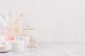 Luxury organic body and skin care spa light cosmetics collection and natural bath accessories on white wood background.