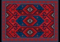 Luxury oriental carpet in red, blue shades with maroon and gray patterns on black background Royalty Free Stock Photo