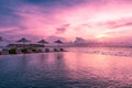 Umbrellas and chairs, infinity swimming pool with sunset sea sky view. Luxury holiday resort vacation travel concept Royalty Free Stock Photo